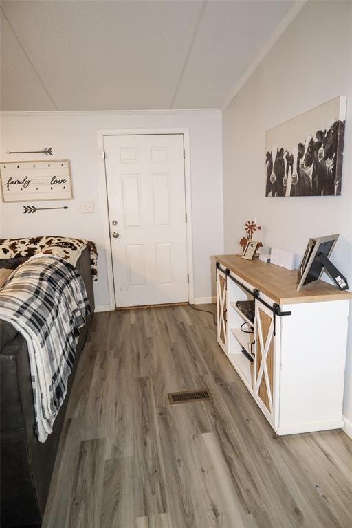 214 Destiny Lane Keatchie, LA 71046 - Photo 6 of 40 a bedroom with a bed and wooden floor