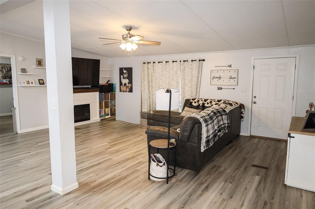 214 Destiny Lane Keatchie, LA 71046 - Photo 8 of 40 a bedroom with furniture and a wooden floor