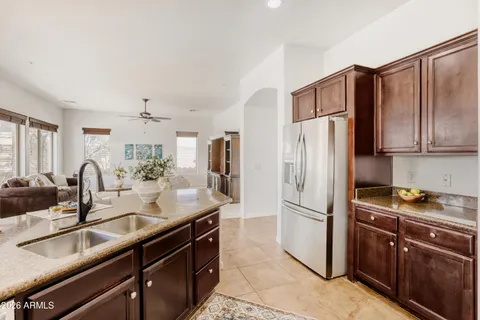 a kitchen with refrigerator cabinets and a sink
