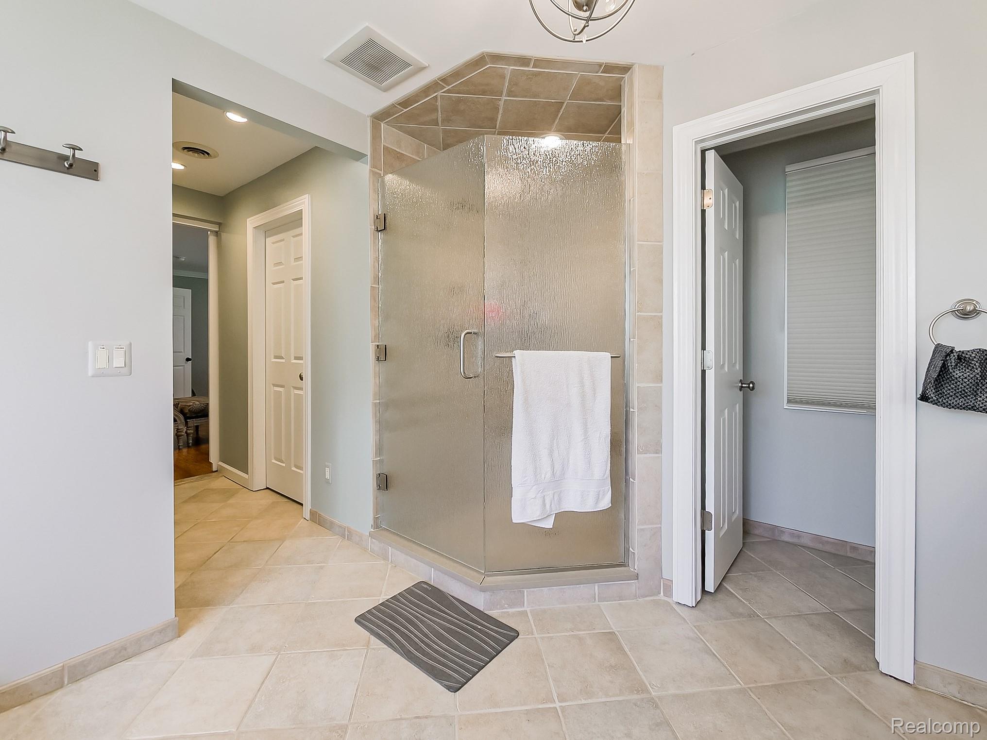 3720 East Clarkston Road Oakland, MI 48363 - Photo 20 of 60 Bathroom with a shower stall and light tile patterned floors