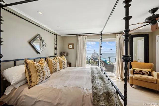 a bedroom with a large bed and a couch