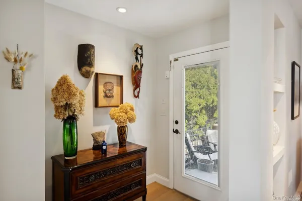 a living room with furniture and a mirror