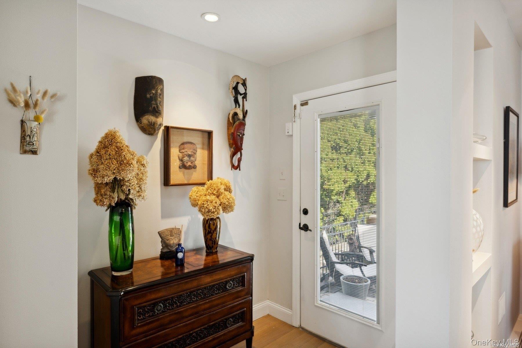 2 West Hillover Road Hampton Bays, NY 11946 - Photo 13 of 42 a living room with furniture and a mirror