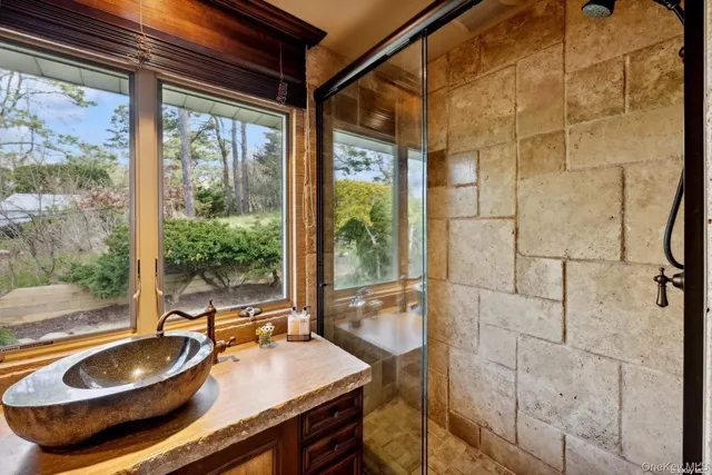 a dining room with granite countertop a sink and a wooden floor