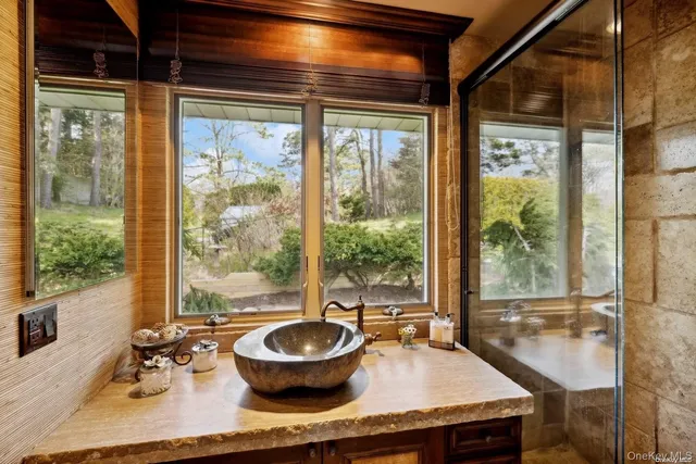 a living room with dining table and a large window