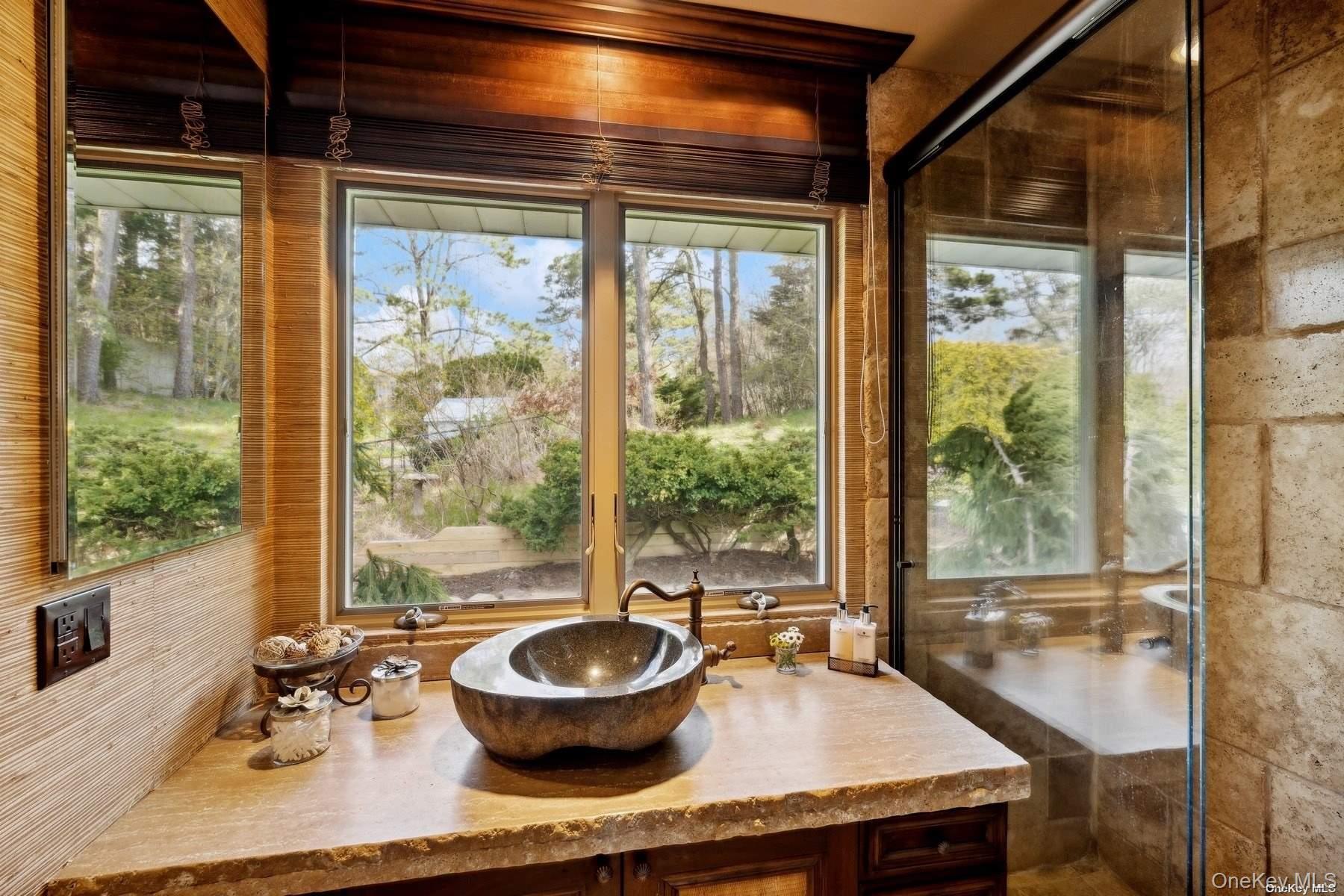 2 West Hillover Road Hampton Bays, NY 11946 - Photo 17 of 42 a living room with dining table and a large window