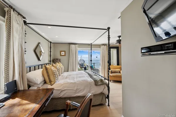 a bedroom with furniture and a window