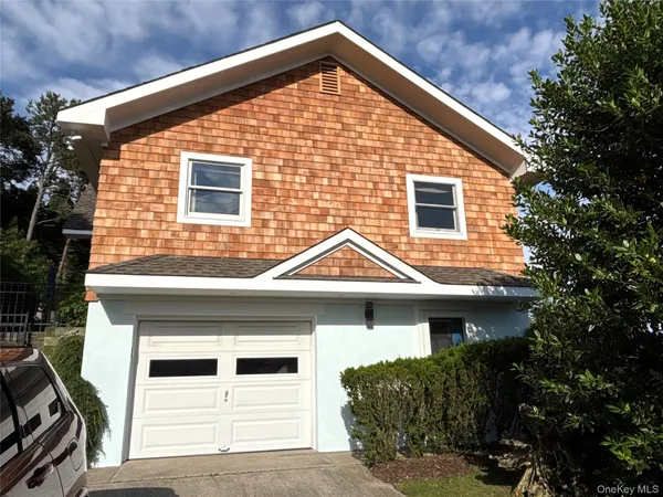 a view of a house with garage