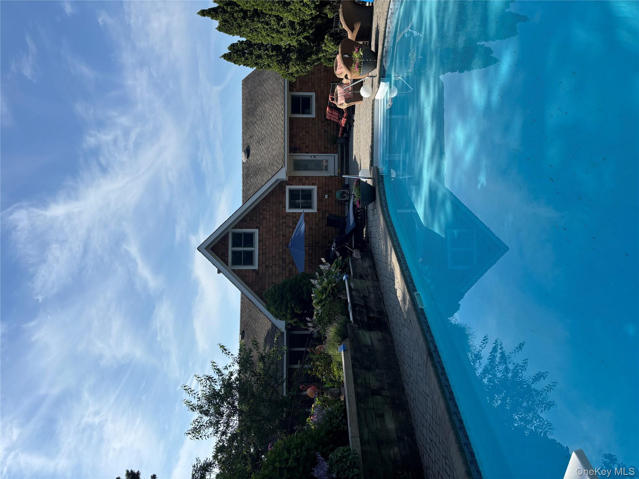 2 West Hillover Road Hampton Bays, NY 11946 - Photo 38 of 42 a front view of a house with garden