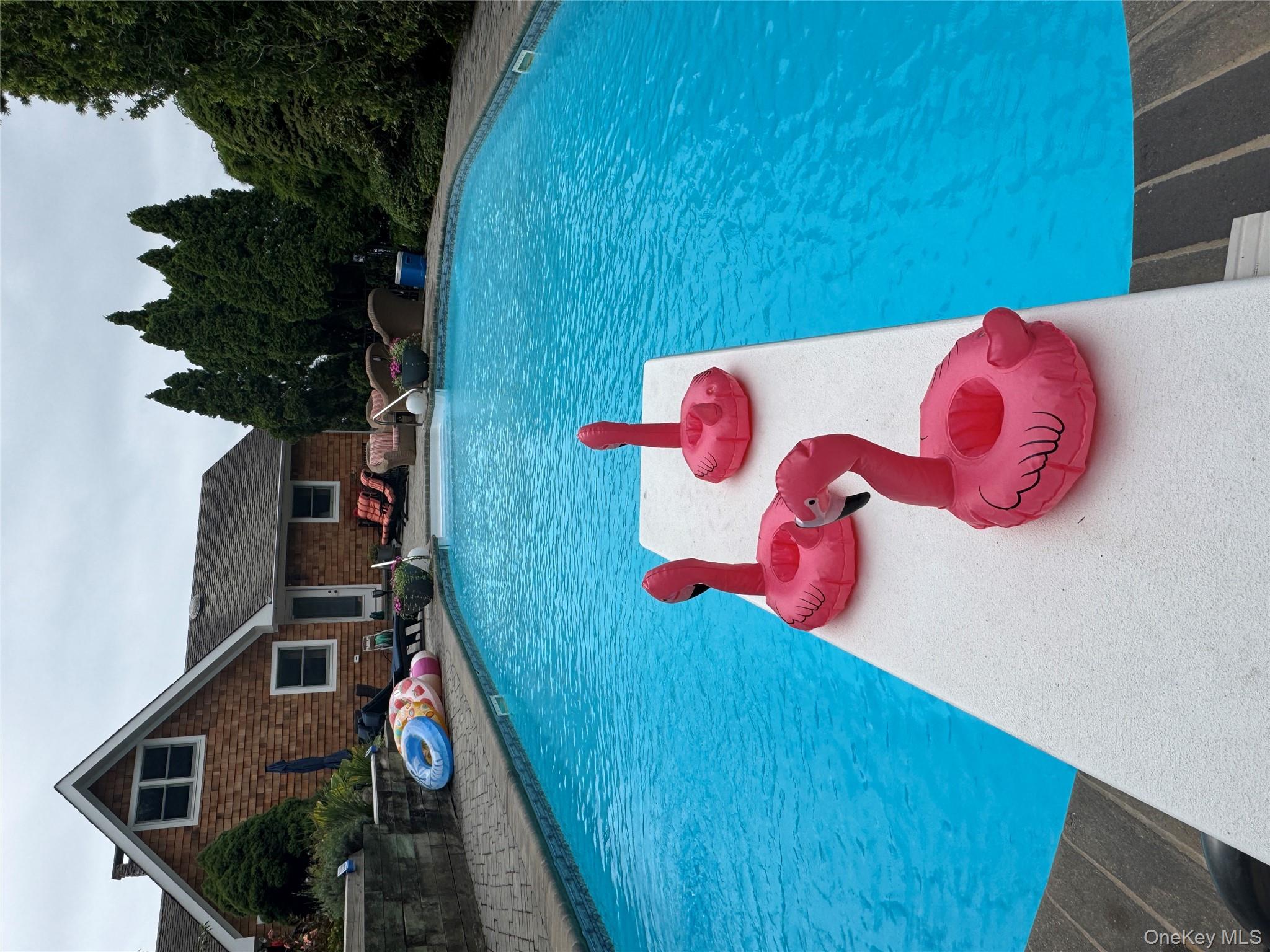 2 West Hillover Road Hampton Bays, NY 11946 - Photo 41 of 42 a front view of a house with a yard
