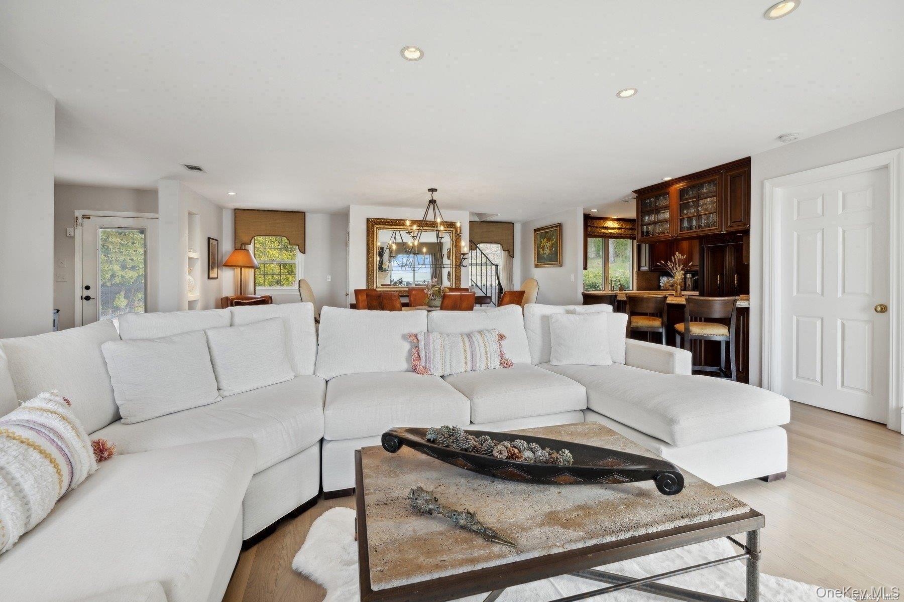 2 West Hillover Road Hampton Bays, NY 11946 - Photo 7 of 42 a living room with furniture and a flat screen tv