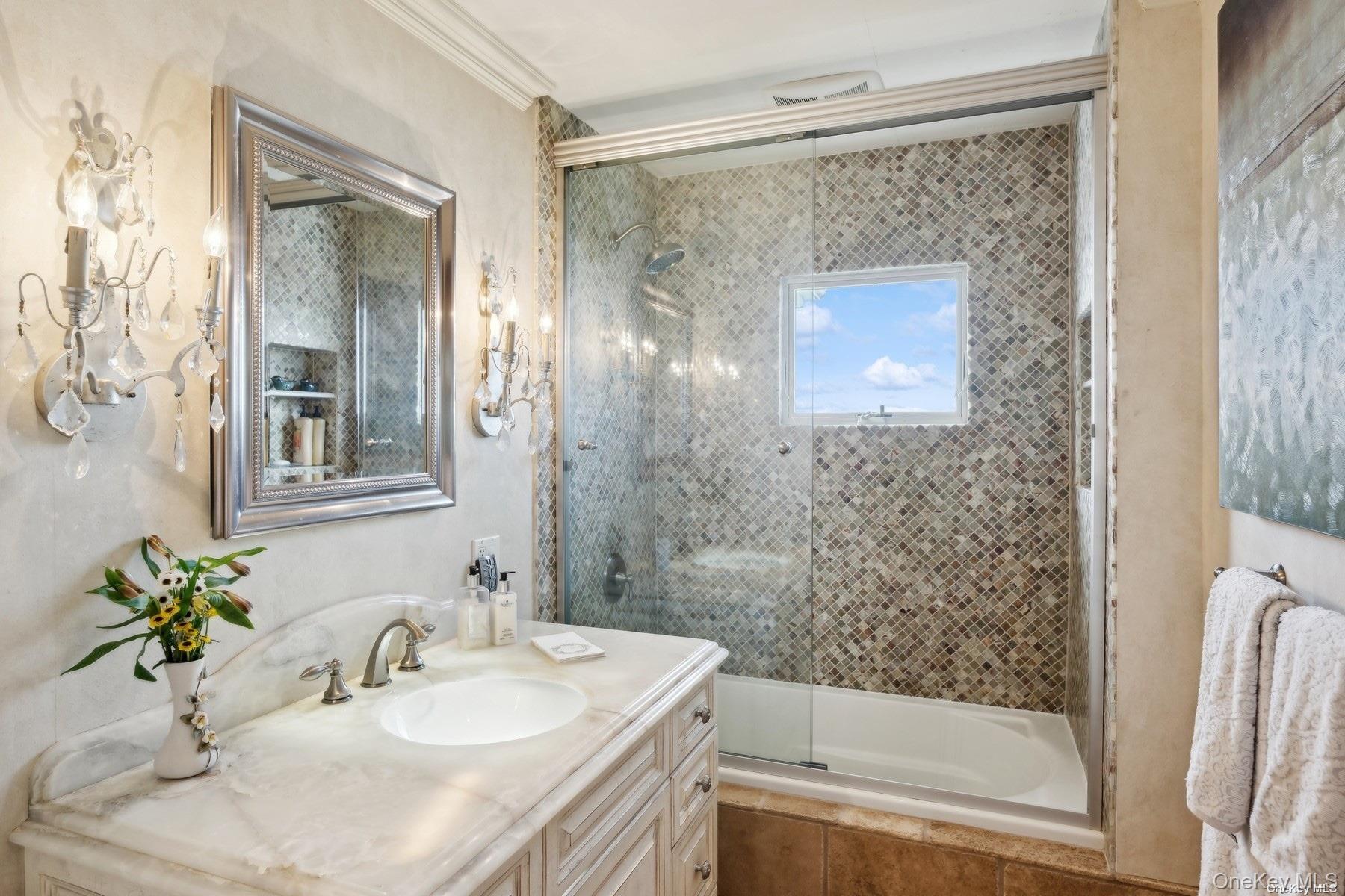 2 West Hillover Road Hampton Bays, NY 11946 - Photo 10 of 42 a bathroom with a sink and a mirror