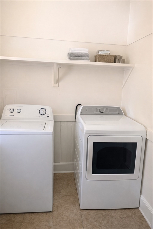 832 Washington Street, Unit 3 Boston, MA 02124 - Photo 7 of 14 a utility room with dryer and washer