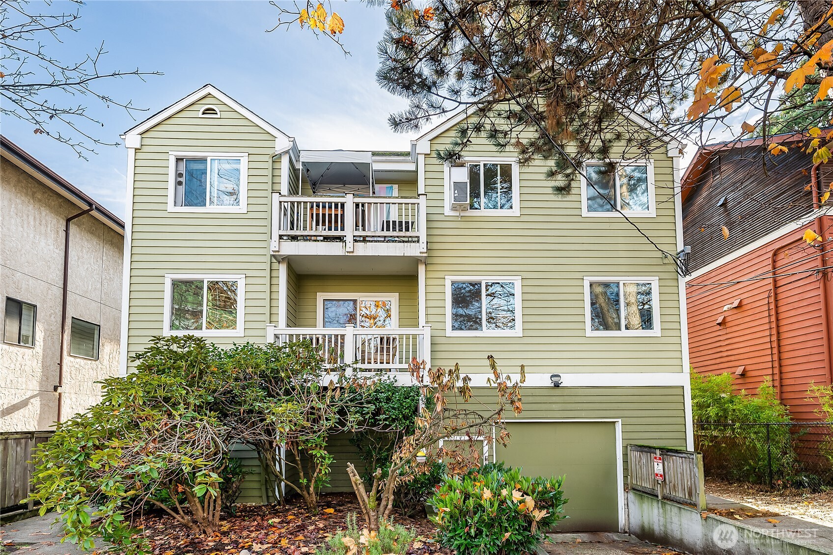 1519 Northwest 59th Street, Unit 101 Seattle, WA 98107 - Photo 1 of 23 a view of front a house with a yard