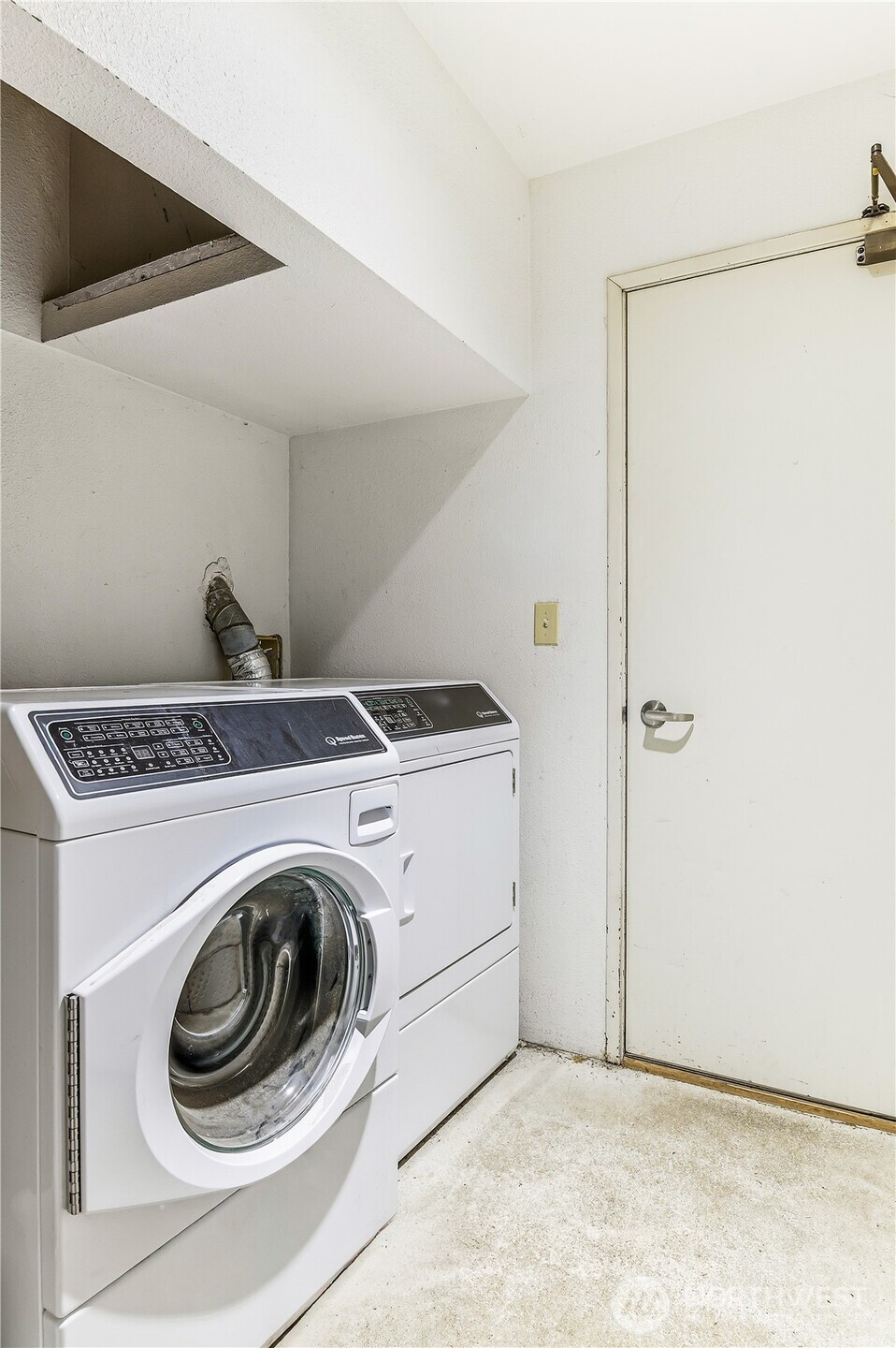 1519 Northwest 59th Street, Unit 101 Seattle, WA 98107 - Photo 19 of 23 a utility room with dryer and washer