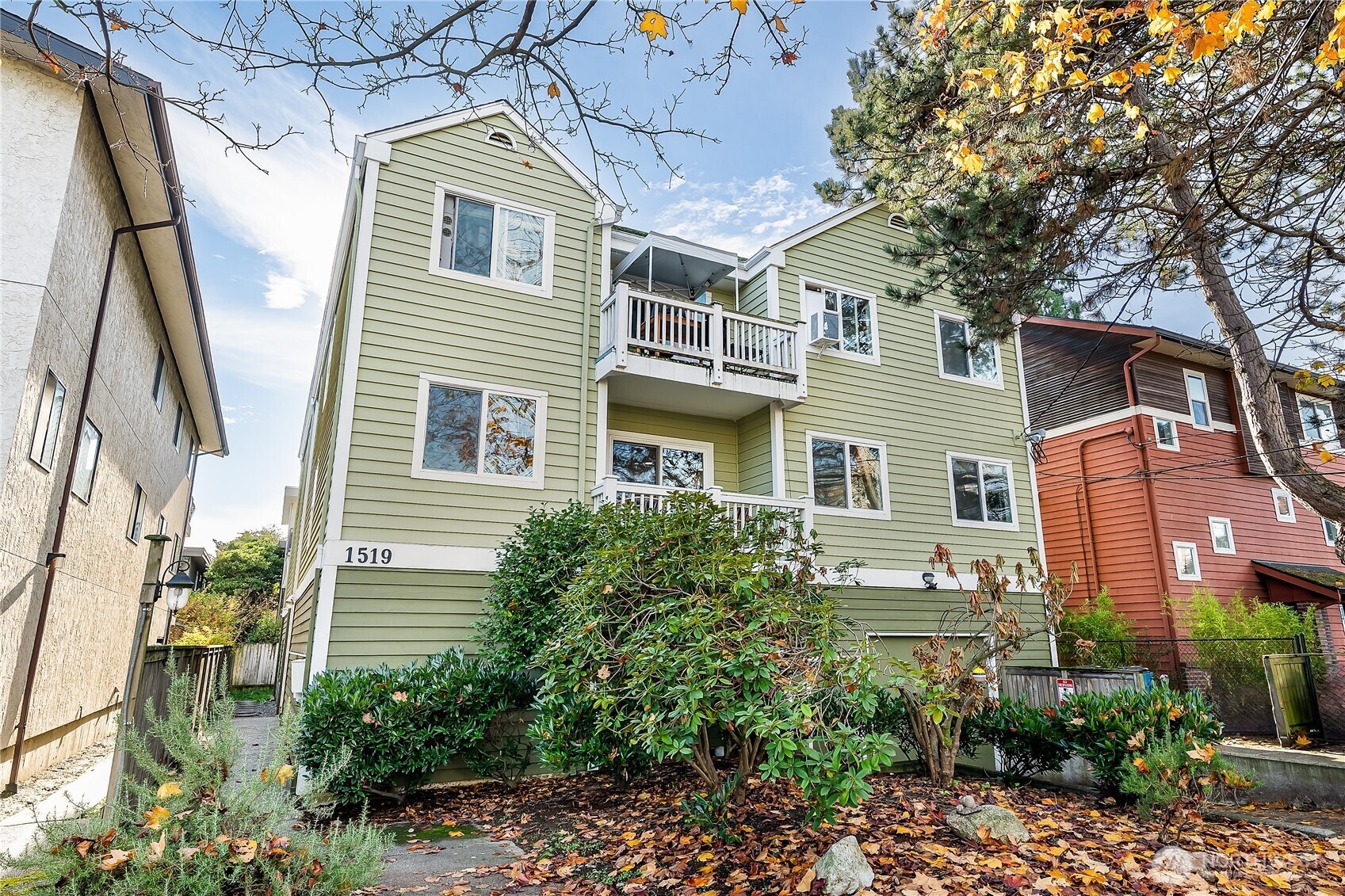 1519 Northwest 59th Street, Unit 101 Seattle, WA 98107 - Photo 23 of 23 a front view of a house with a garden