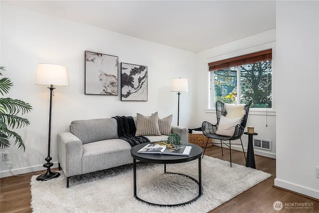 a living room with furniture and a large window