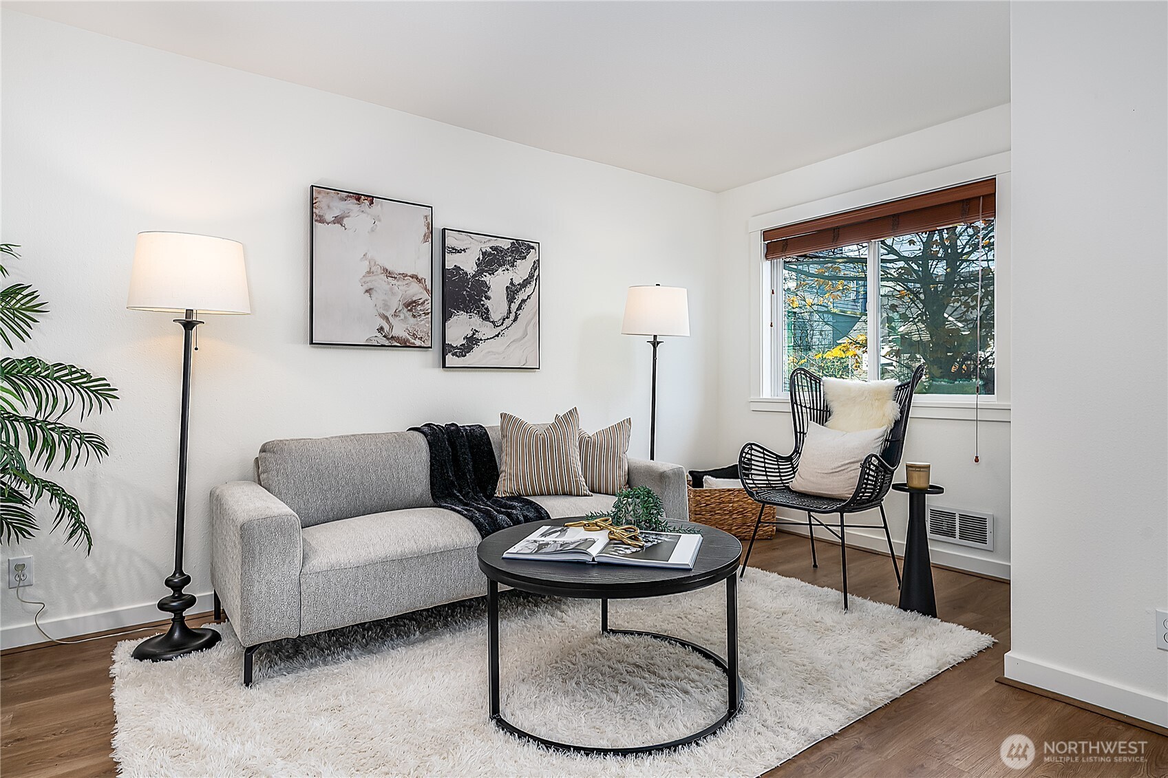 1519 Northwest 59th Street, Unit 101 Seattle, WA 98107 - Photo 4 of 23 a living room with furniture and a large window