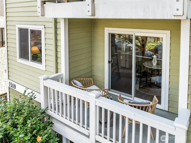a view of a brick house with a large window