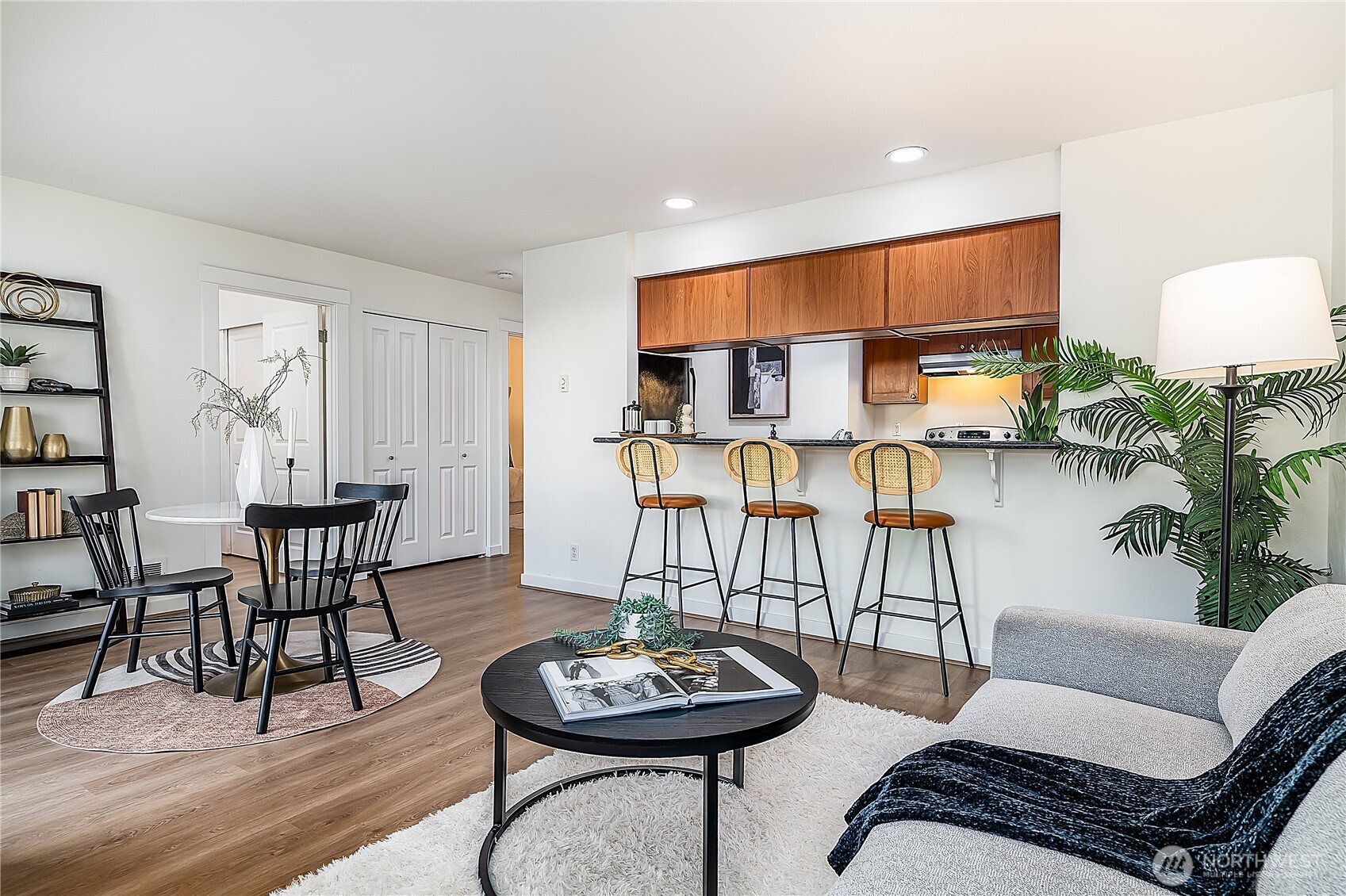 1519 Northwest 59th Street, Unit 101 Seattle, WA 98107 - Photo 8 of 23 a living room with furniture and a wooden floor