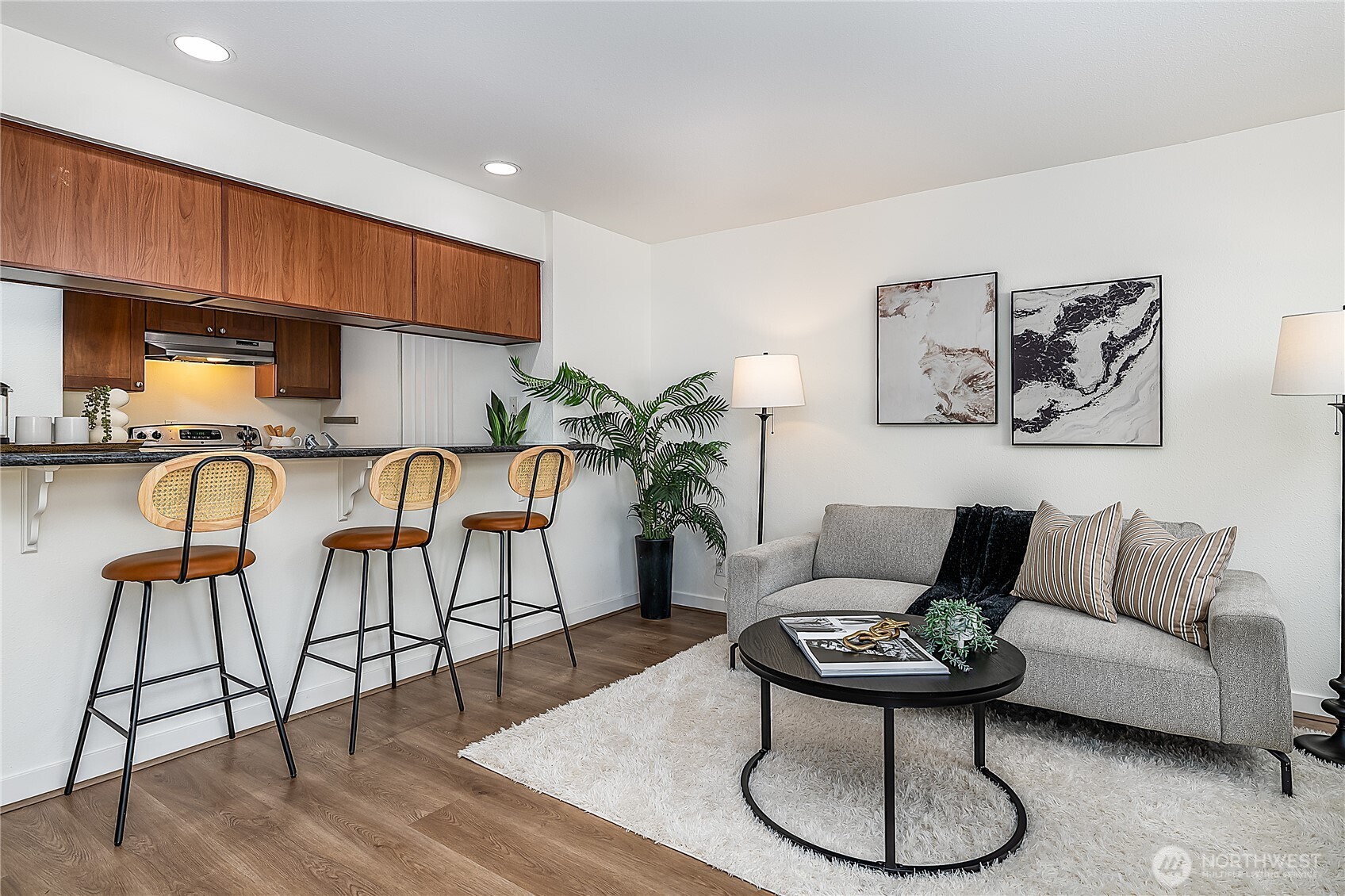 1519 Northwest 59th Street, Unit 101 Seattle, WA 98107 - Photo 9 of 23 a living room with furniture and a wooden floor