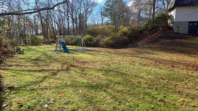 a view of a yard with a tree