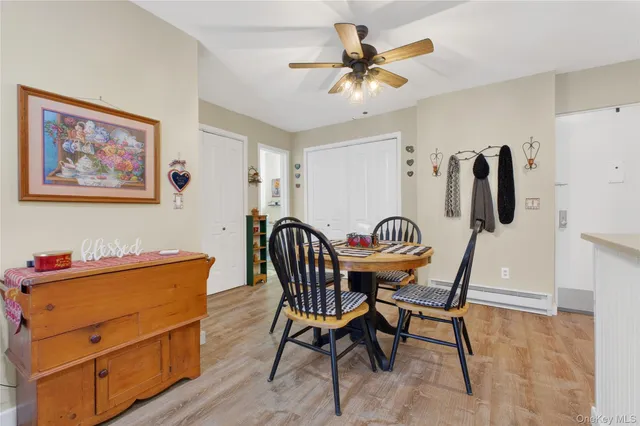 a dining room with furniture and window