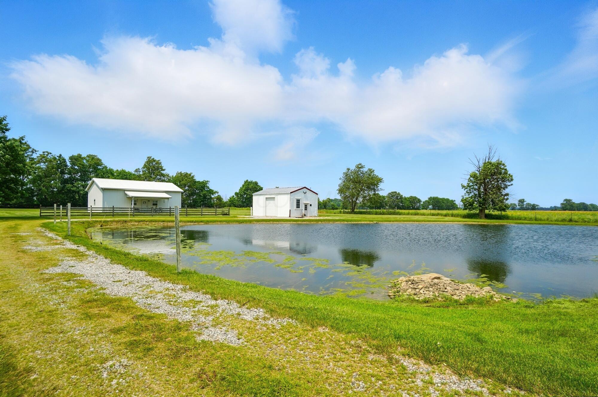 8430 Patterson Road Hilliard, OH 43026 - Photo 64 of 88 Gravel drivway beside pond leads to barn