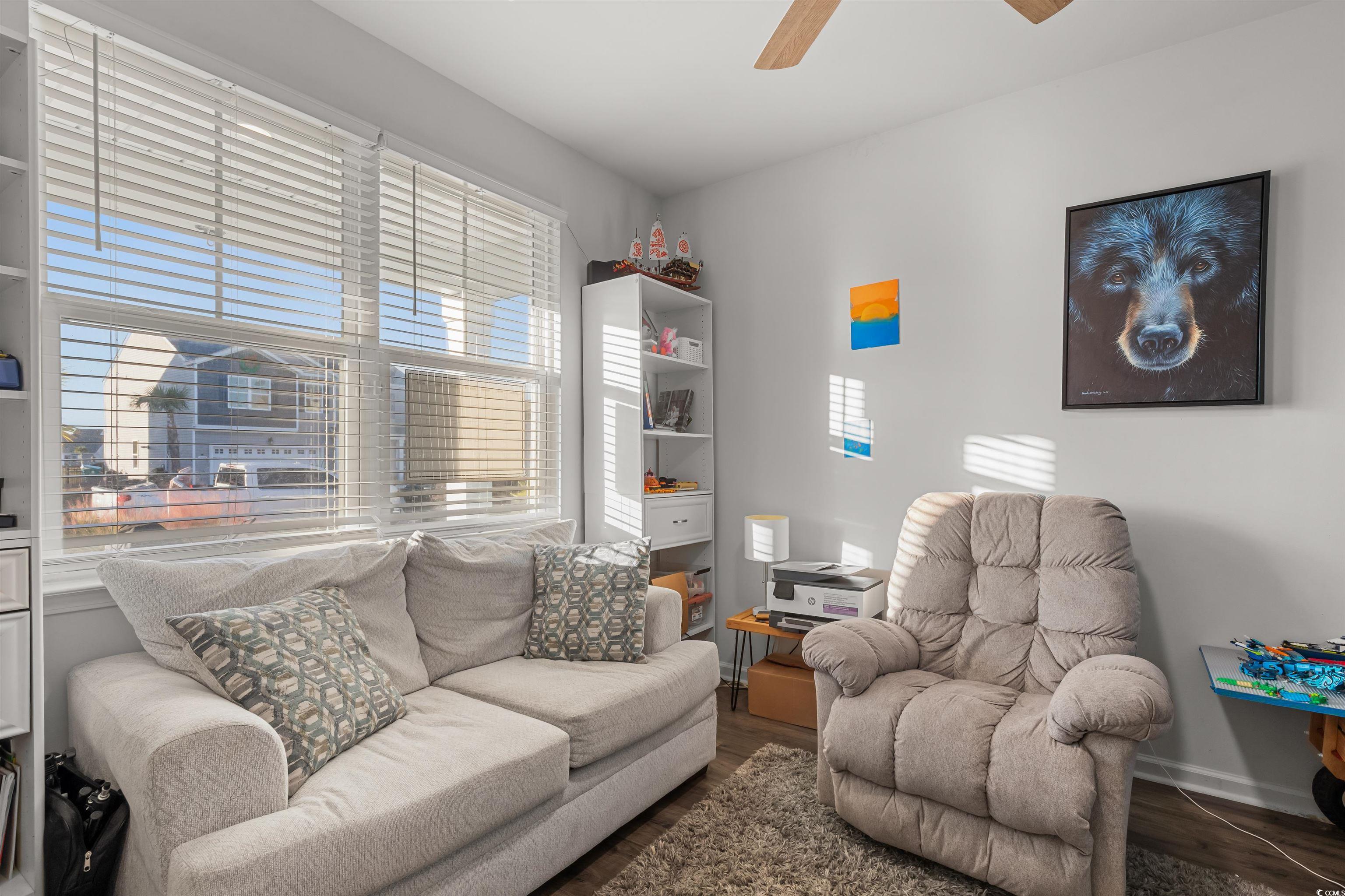 2004 Musgrove Mill Way Myrtle Beach, SC 29579 - Photo 16 of 35 Living area with dark wood-style floors and ceiling fan