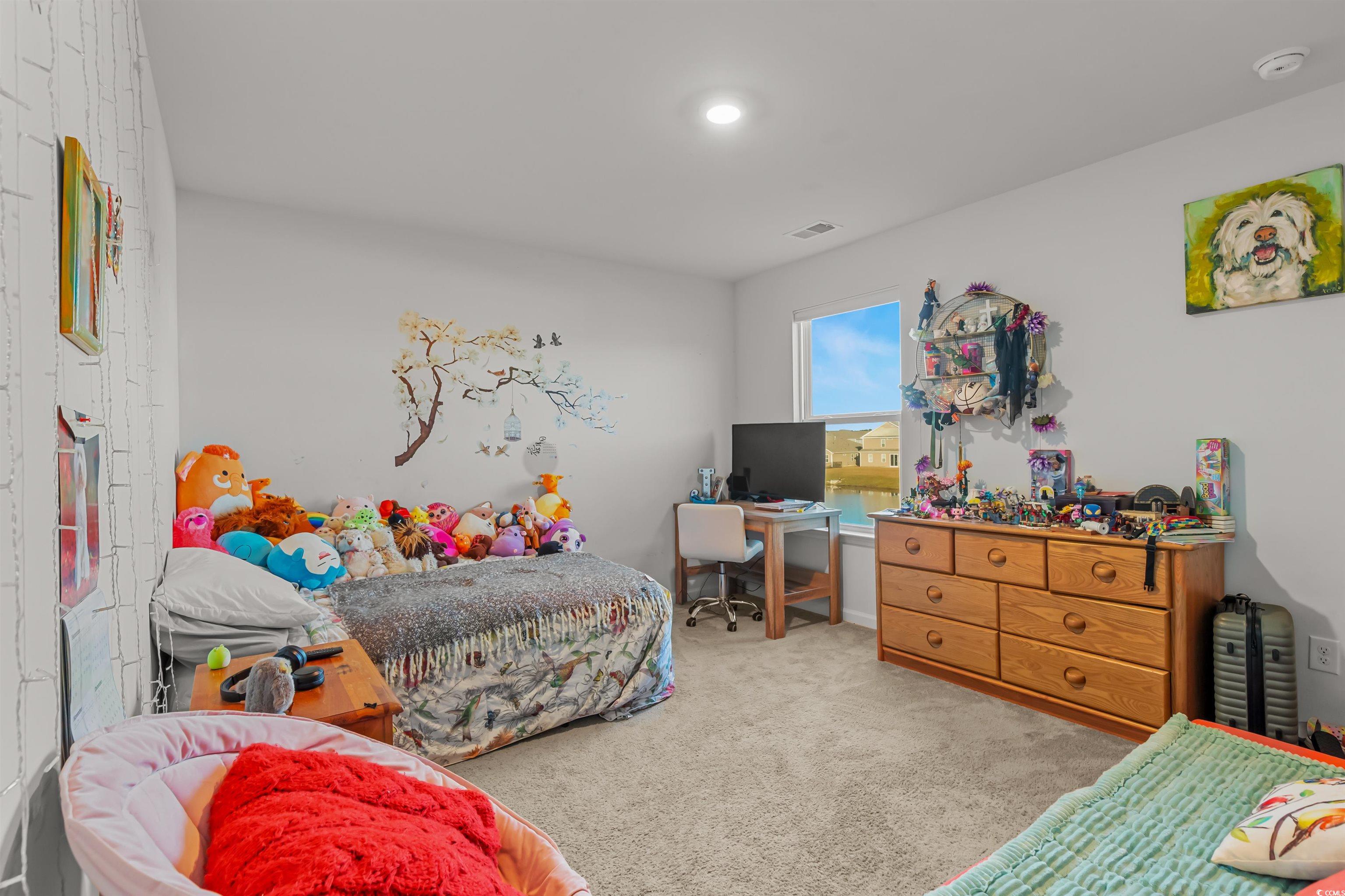 2004 Musgrove Mill Way Myrtle Beach, SC 29579 - Photo 20 of 35 Bedroom featuring light carpet and a desk