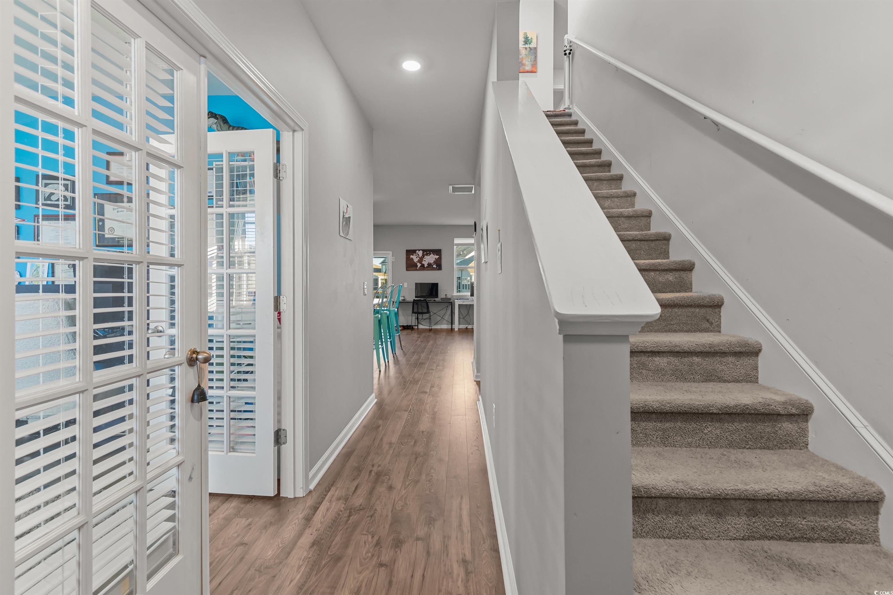 2004 Musgrove Mill Way Myrtle Beach, SC 29579 - Photo 2 of 35 Stairway with wood finished floors and recessed lighting
