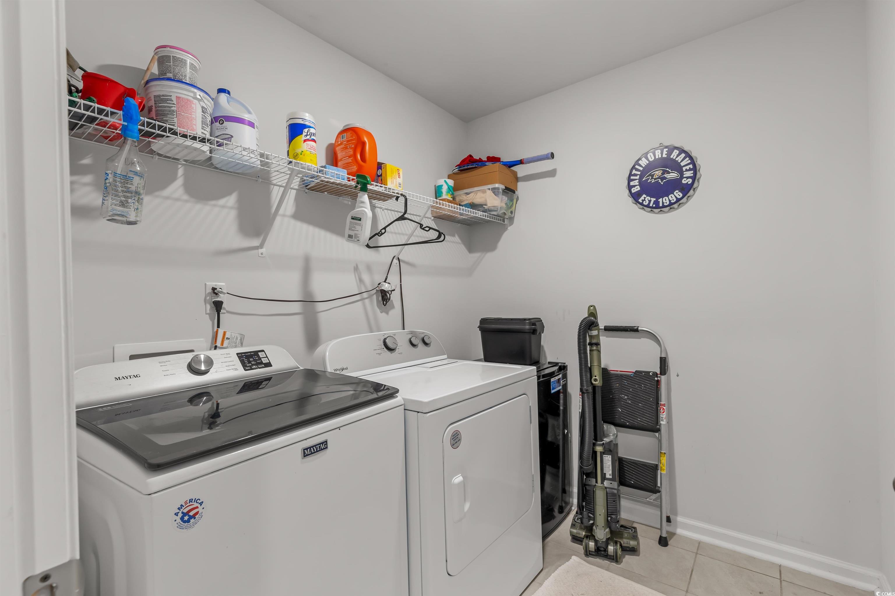 2004 Musgrove Mill Way Myrtle Beach, SC 29579 - Photo 24 of 35 Laundry room featuring light tile patterned flooring and separate washer and dryer