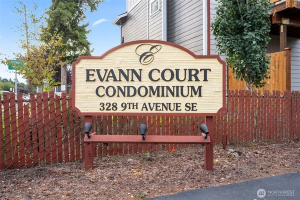 a sign that is on a brick wall