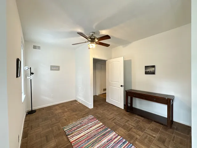 a view of a hallway with a workspace