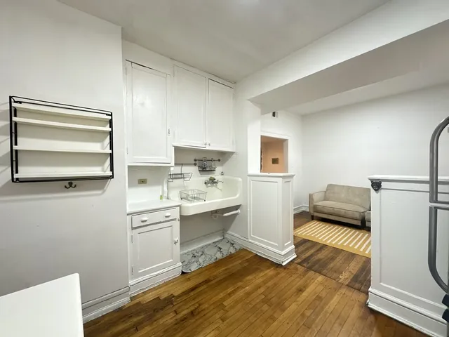 a kitchen with a sink and a stove top oven