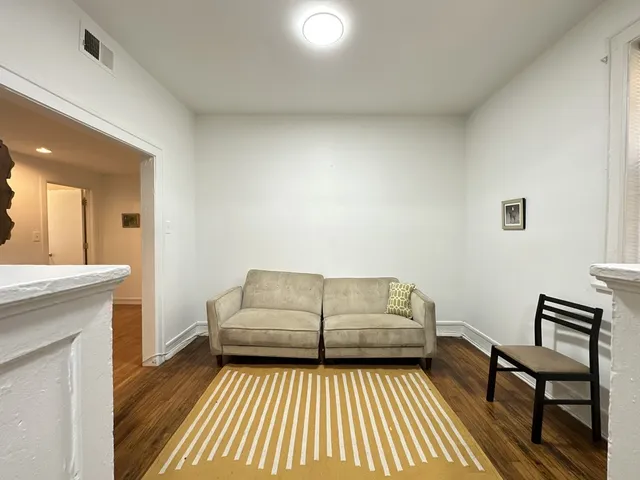 a living room with furniture and a rug