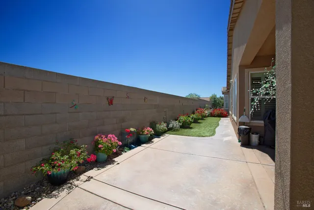 a view of house with a yard