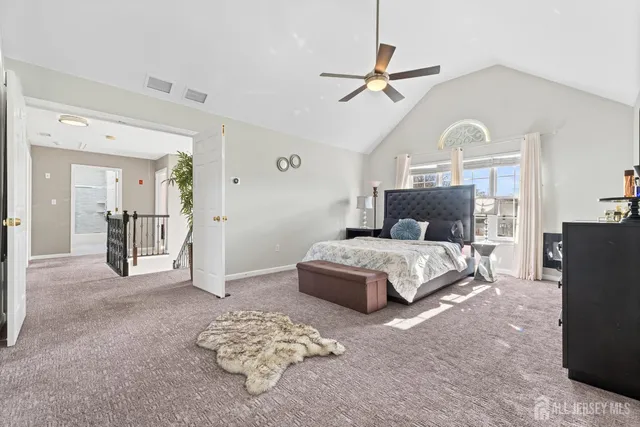 a bedroom with a bed mirror and a kitchen island
