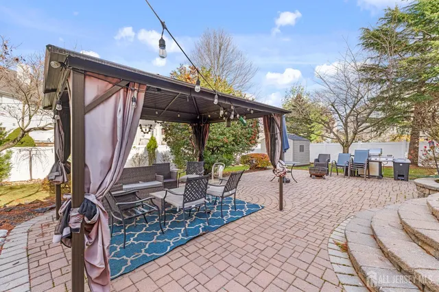 a view of a house with a yard porch and sitting area