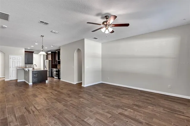 a view of a kitchen with a sink and cabinet