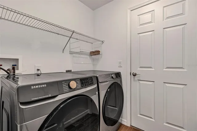 a utility room with dryer and washer