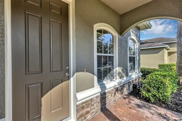 a front view of a house with outdoor seating