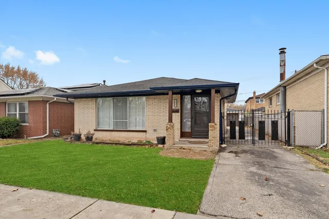 a front view of a house with a yard and porch