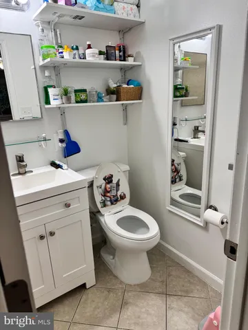 a bathroom with a sink toilet and vanity
