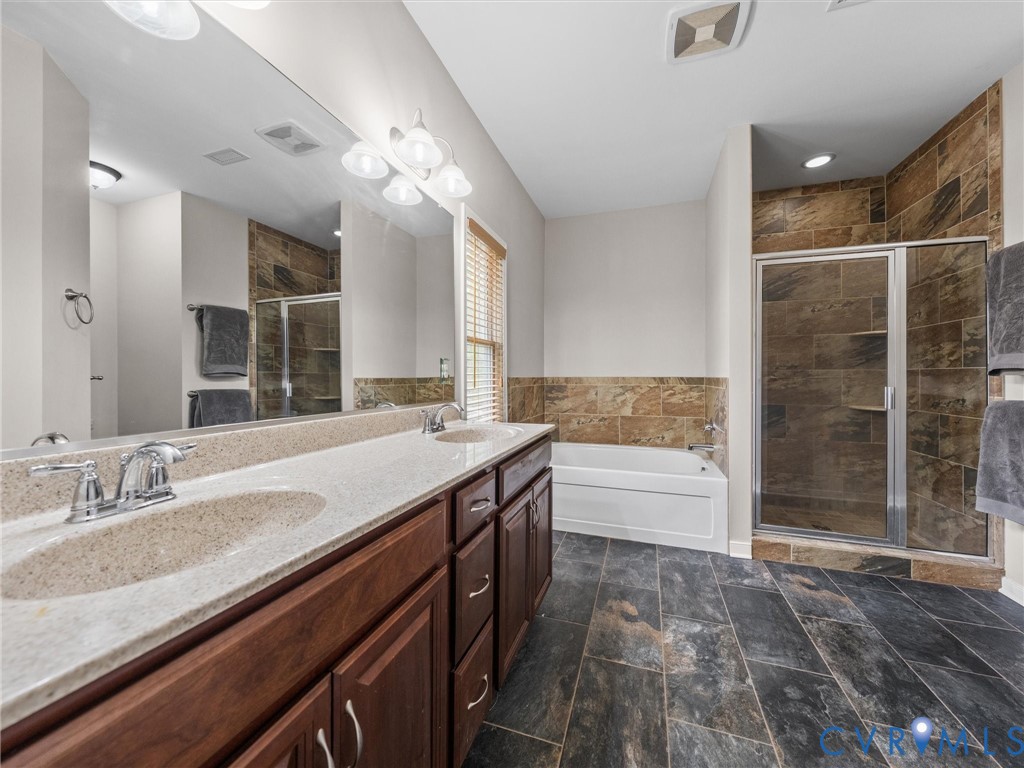 10824 Avening Road Chesterfield, VA 23832 - Photo 24 of 47 a spacious bathroom with a granite countertop sink a toilet a mirror and shower