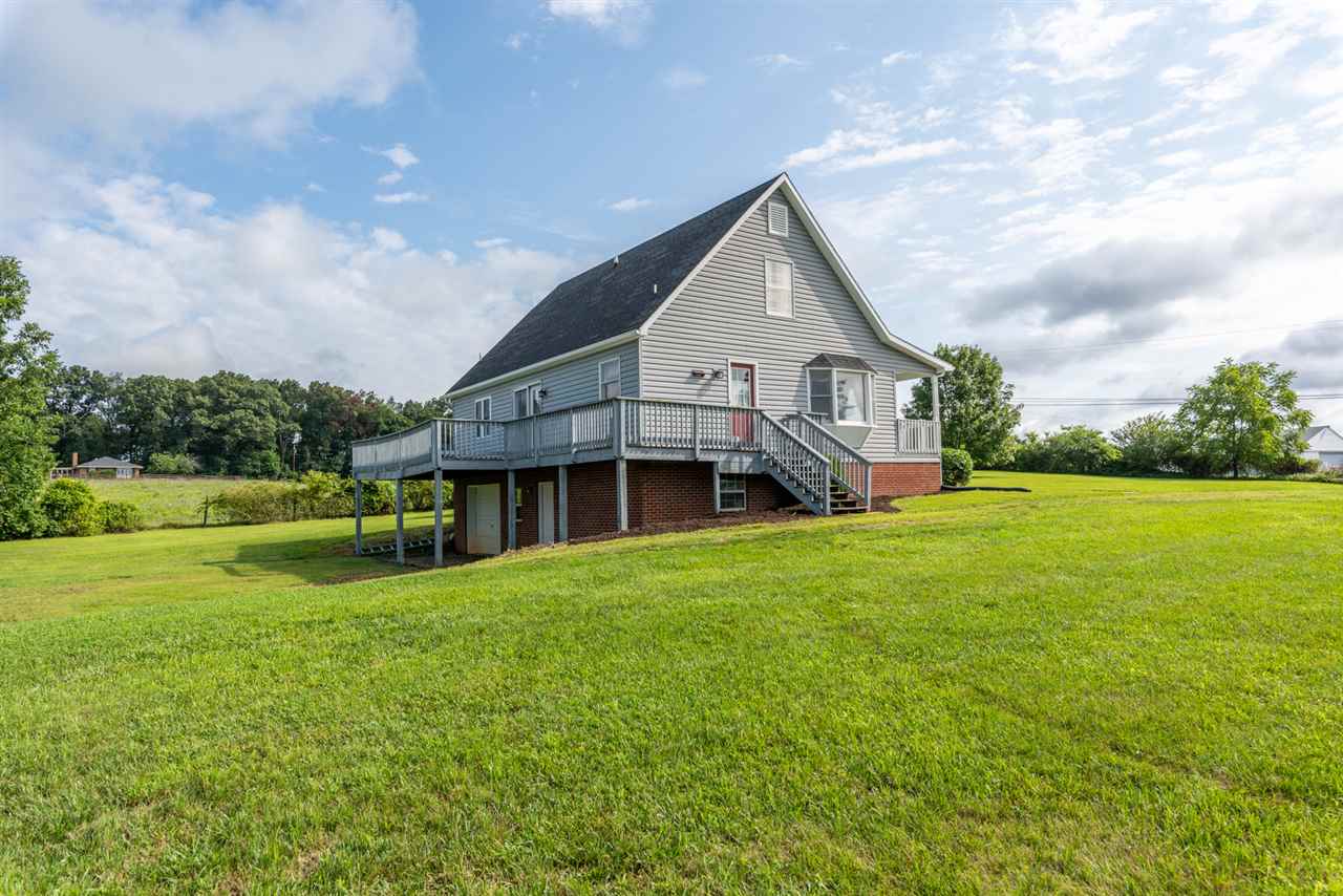 565 Kindig Road Waynesboro, VA 22980 - Photo 44 of 50 a view of a house with a big yard potted plants and large tree