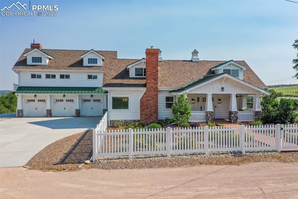 2073 North Perry Park Road Sedalia, CO 80135 - Photo 1 of 40 a front view of a house with a porch