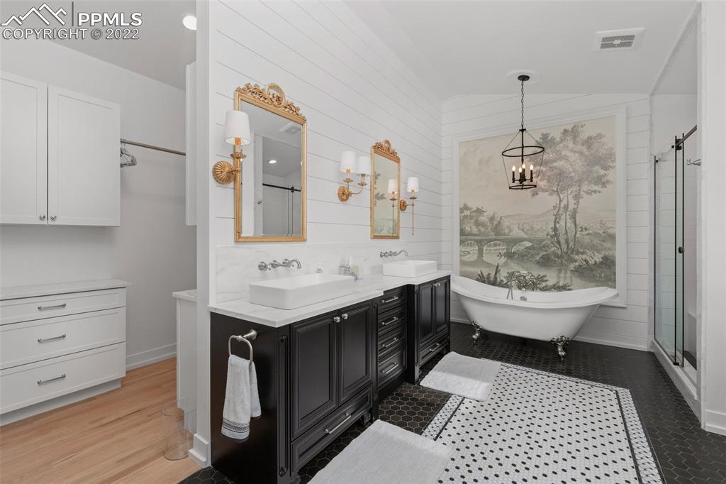 2073 North Perry Park Road Sedalia, CO 80135 - Photo 13 of 40 a bathroom with a sink a toilet and shower
