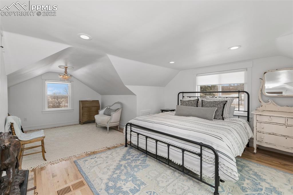2073 North Perry Park Road Sedalia, CO 80135 - Photo 16 of 40 a bedroom with a bed and window