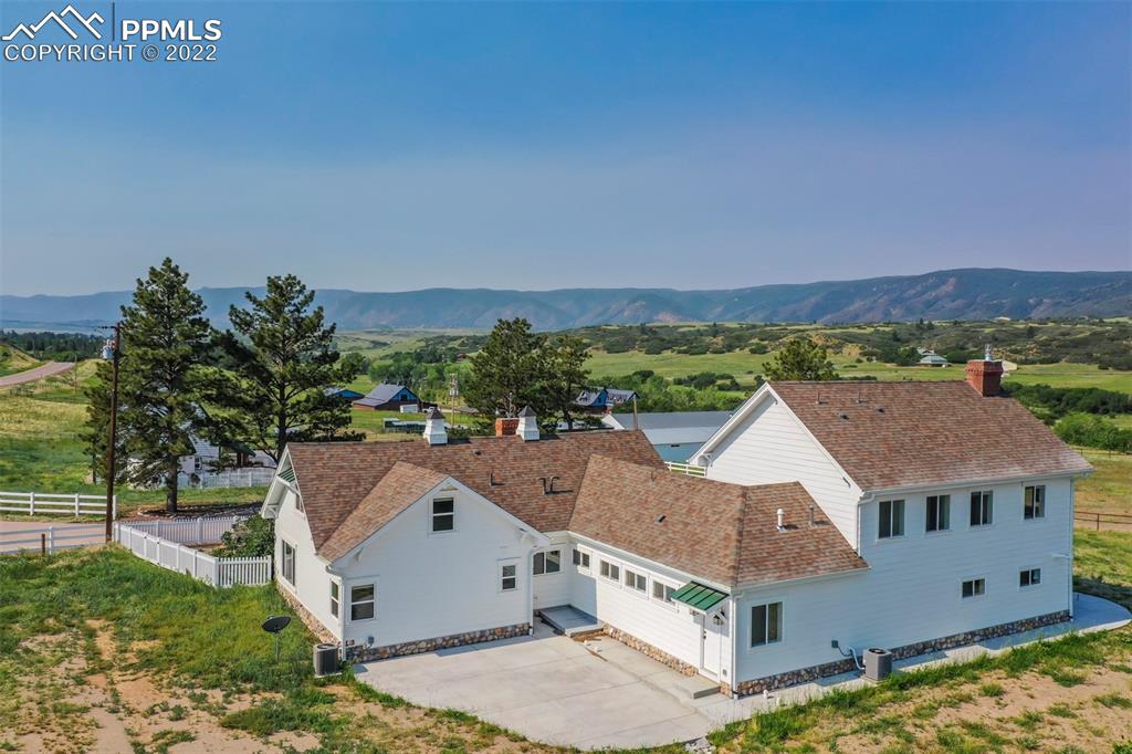 2073 North Perry Park Road Sedalia, CO 80135 - Photo 2 of 40 an aerial view of residential houses with outdoor space and trees